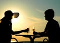 Pair silhouette sit at a table Royalty Free Stock Photo