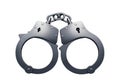 Silver-colored handcuffs lying open on a white background Royalty Free Stock Photo