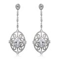 Pair of silver diamond earrings isolated on white