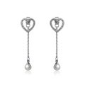 Pair of silver diamond earrings isolated on white