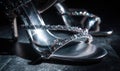 A pair of silver high heels with a silver strap Royalty Free Stock Photo