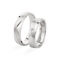 Pair of silver wedding rings isolated on white background Royalty Free Stock Photo