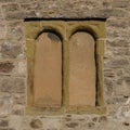 A pair of simple, blocked up windows