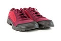 A pair of simple cheap crimson red hiking shoes isolated on white background - perspective close-up view Royalty Free Stock Photo