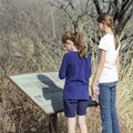 A Pair of Sisters Reads a Sign at the Murray Springs Clovis Site