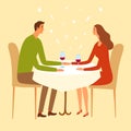 Pair sitting in a restaurant and holding hands.