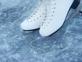 A pair of skates lies on the ice. Winter skiing on the frozen ice of the lake or on the ice rink.