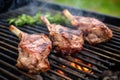 pair skewering lamb chops for a backyard bbq