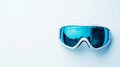 A pair of ski goggles displayed on a clean, snow-white background with Royalty Free Stock Photo
