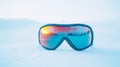 A pair of ski goggles displayed on a clean, snow-white background with Royalty Free Stock Photo