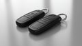 pair of sleek modern car keys featuring digital fobs rests on clean minimalist table showcasing subtle reflections Royalty Free Stock Photo