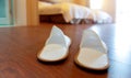 Pair of slippers on parquet floor