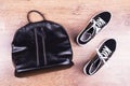 Pair of sneakers, black backpack