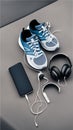 A pair of sneakers, headphones, and a smartphone on the pavement illustration Artificial Intelligence artwork generated Royalty Free Stock Photo