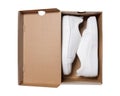 Pair of sneakers in shoe cardboard box isolated on white background Royalty Free Stock Photo