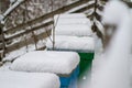 A pair of snow covered bee hives. Apiary in wintertime. Beehives covered with snow in wintertime.