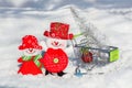 A pair of snowmen a husband and wife in a grocery cart drive a Christmas tree and toys home. Merry Christmas and Happy New Year,