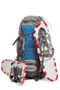 A pair of snowshoes and backpack traveler