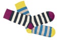 Pair socks with different lines isolated on white background. Colorful socks son white background. Colored socks on the leg