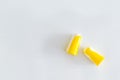 Pair of soft foam ear plugs on white background, close-up. Royalty Free Stock Photo