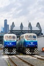 Pair of Sound Transit commuter trains in front of the Seattle skyline