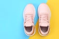 Pair of sport shoes on colorful background. copy space.Overhead shot of running shoes. Top view, flat lay Royalty Free Stock Photo