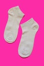 Pair of sport socks on bright pink background Royalty Free Stock Photo