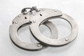 Pair of steel handcuffs close up, Silver metal handcuffs Royalty Free Stock Photo