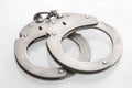 Pair of steel handcuffs close up, Silver metal handcuffs Royalty Free Stock Photo