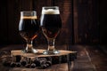 pair of stout beer glasses on rustic wooden table Royalty Free Stock Photo