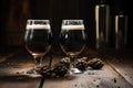 pair of stout beer glasses on rustic wooden table Royalty Free Stock Photo