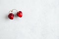 Pair of strange, ugly cherries in the heart shape on a white background. Trendy ugly organic product. Malformed berry Royalty Free Stock Photo