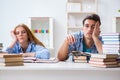 The pair of students studying for university exams Royalty Free Stock Photo