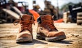 A Pair of Stylish Brown Boots Standing Proudly on a Rustic, Earthy Landscape