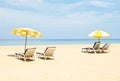 Pair of sun loungers and a beach umbrellas on the beach