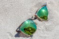 Pair Of Sunglasses On The Beach With A Reflection Of A Beautiful Royalty Free Stock Photo