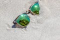 Pair Of Sunglasses On The Beach With A Reflection Of A Beautiful Royalty Free Stock Photo