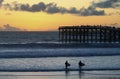 A Pair of Sunset Surfers at Crystal Pier, San Diego, CA Royalty Free Stock Photo