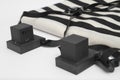 Pair of tefillin , A symbol of the Jewish people, a pair of tefillin with black straps, isolated on a white background