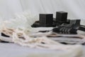 Pair of tefillin , A symbol of the Jewish people, a pair of tefillin with black straps, on a white background