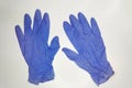 A pair of thin women`s silicone medical gloves