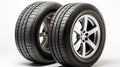 A pair of tires. Wheels of vehicles stacked up. lone automobile tires on a white background. Generative AI