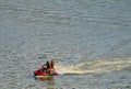 A pair of tourists on a wave runner, Kamenets Podolskiy, Ukraine