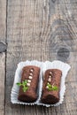 A pair of traditional Russian chocolate biscuit cakes on wooden rustic table