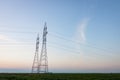 Pair of Transmission Towers Against a Prairie Sunrise Royalty Free Stock Photo