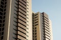 Pair of twin office high-rise buildings with a yellow and brown faÃÂ§ade. Royalty Free Stock Photo