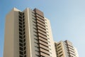 Pair of twin office high-rise buildings with a yellow and brown faÃÂ§ade. Royalty Free Stock Photo