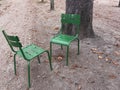 Pair of two empty garden chairs facing each other in Paris park Royalty Free Stock Photo