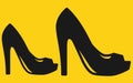 A pair two high heel shoes all bold black silhouette golden yellow backdrop