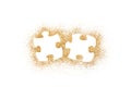 Pair of two matching puzzle pieces on golden glitter isolated on white background